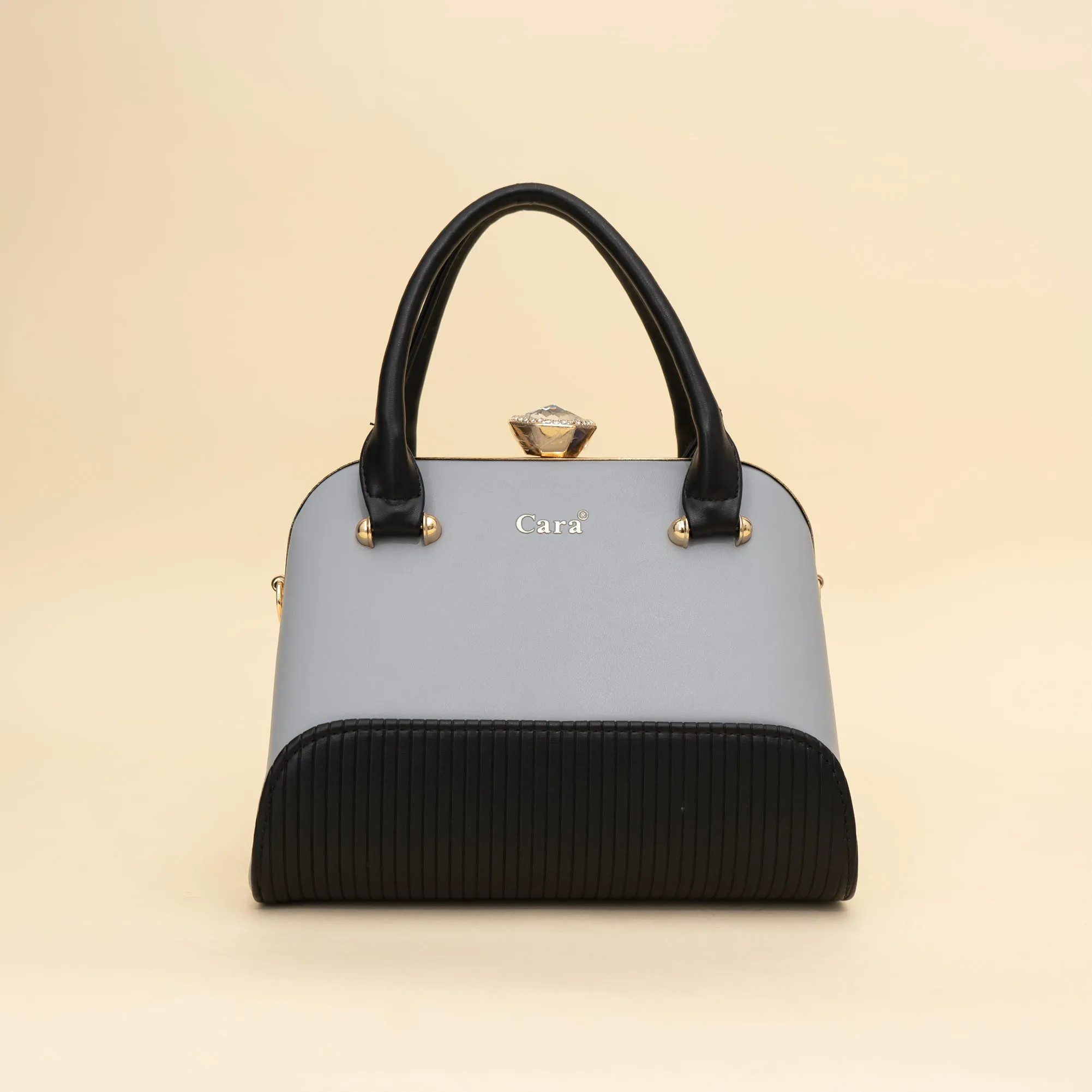 Cara's Glossy Glide satchel bag