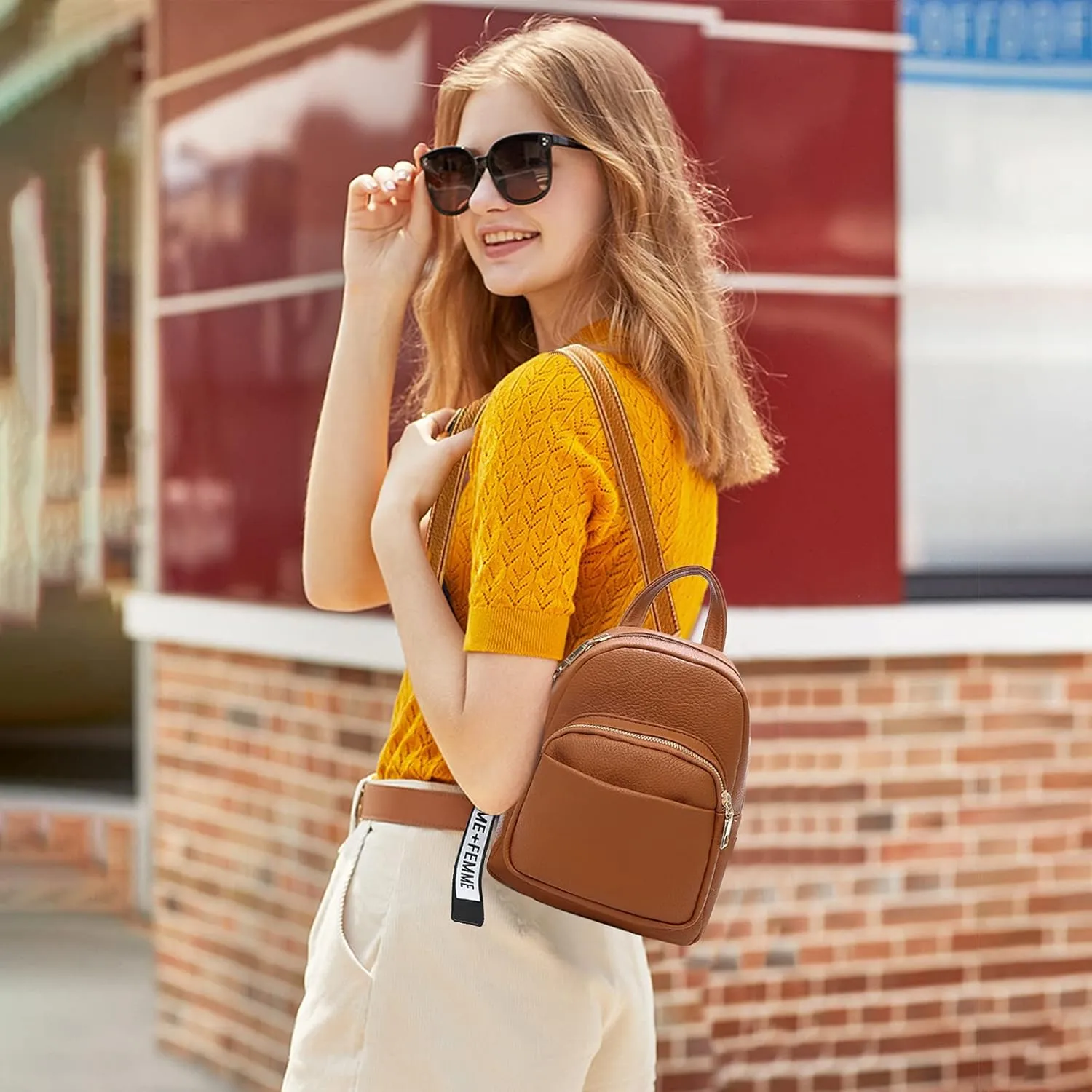 PORRASSO Fashion Mini Backpack Ladies Daypack Small Rucksack with Pompom Women PU Leather Backpack Purse for Travel Dating Shopping Brown